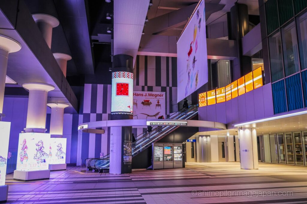 Escalator and elevator hall at Hikarie Basement Level 3, real-life location where Gojo observes trapped civilians in Jujutsu Kaisen